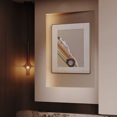InkPoster digital art display with automotive photography in a modern luxury interior