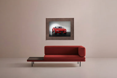 InkPoster digital art display featuring a red sports car in a minimalist modern interior